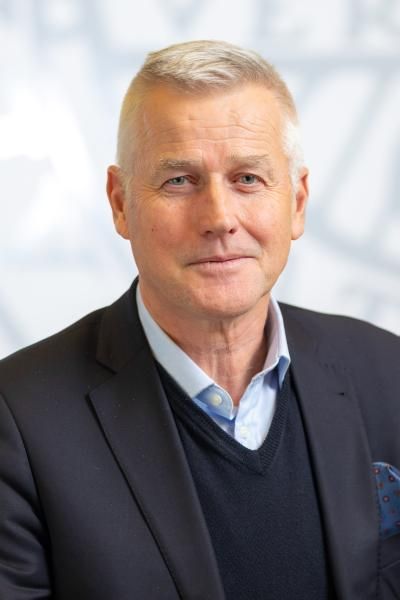 Portrait of slightly smiling man