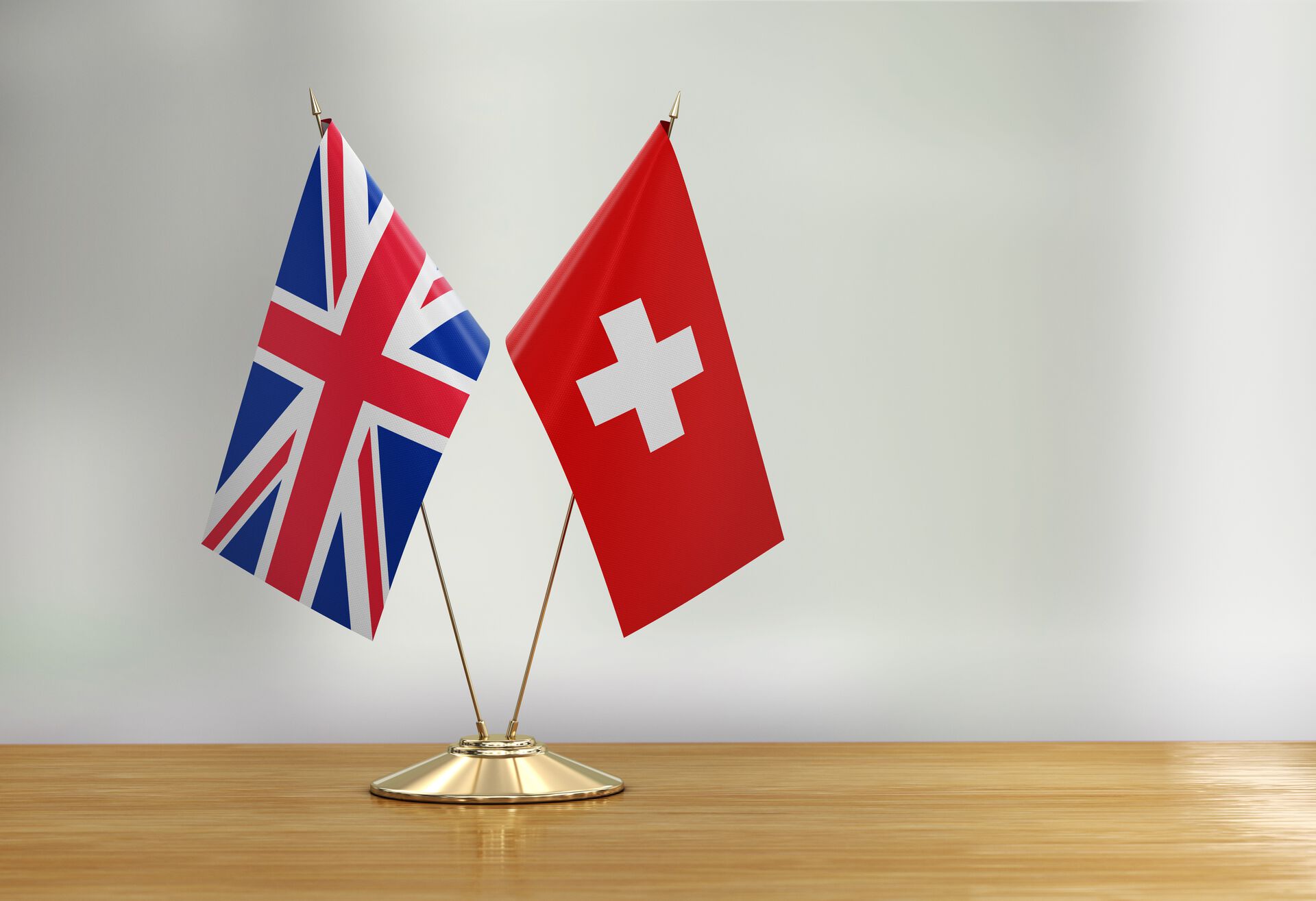 switzerland and uk flags on a table